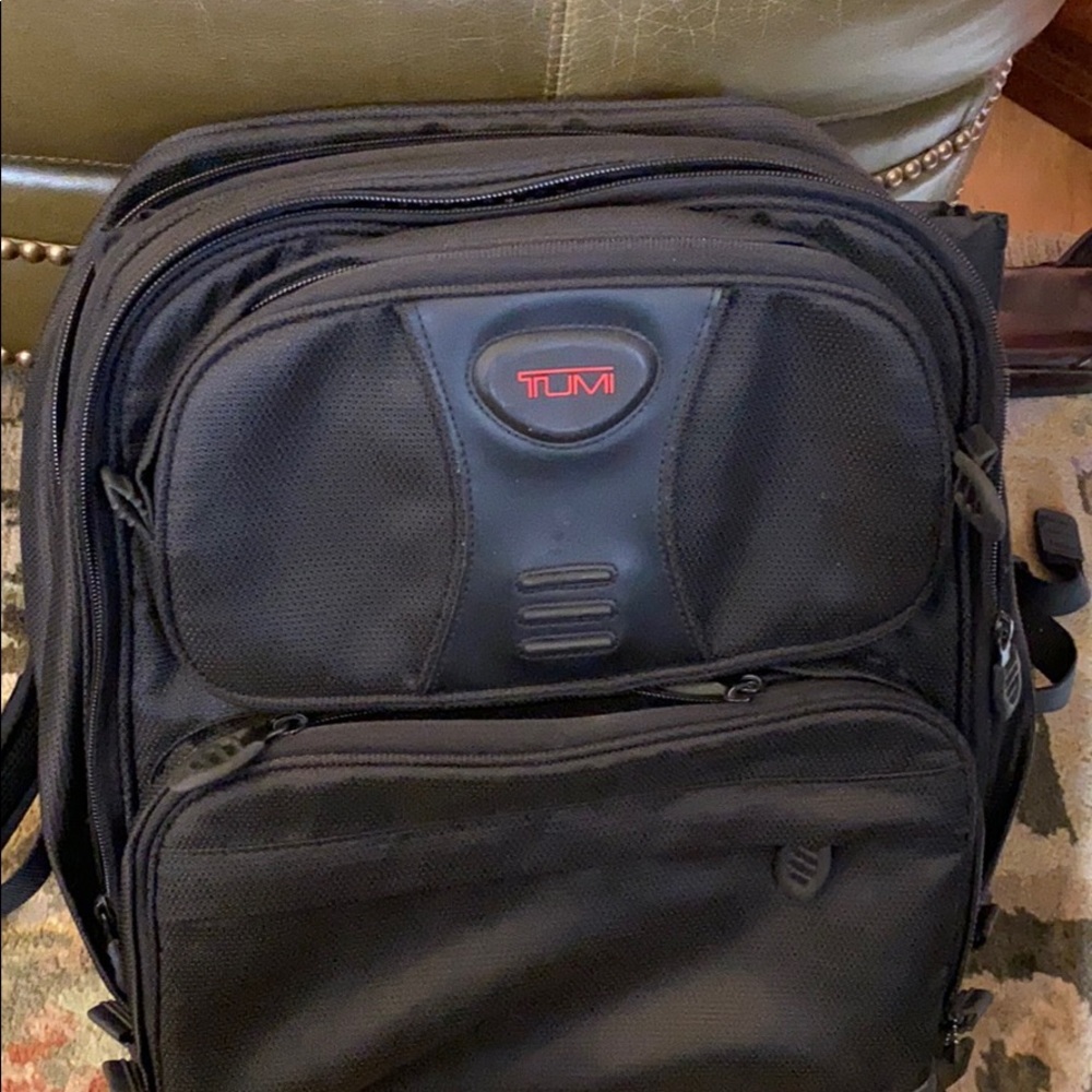 Tumi brief backpack